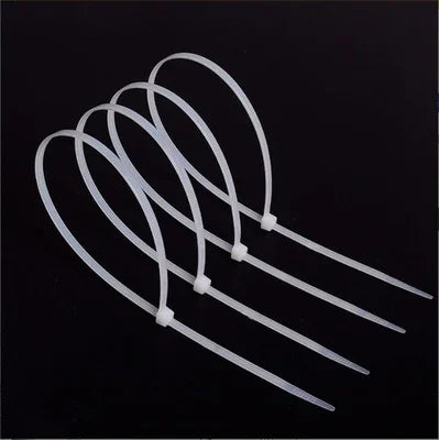 Individu fermant à clef les attaches de câble en nylon blanches des attaches de câble en nylon 66 de 3.6mmX200mm